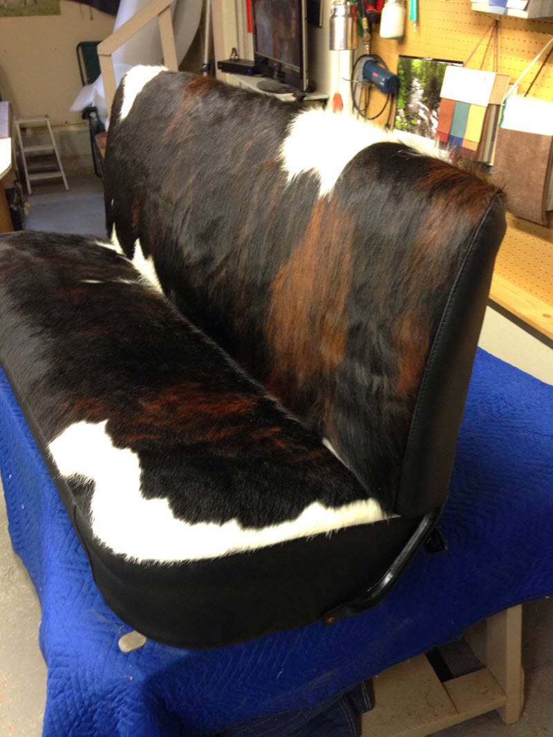 This unique cowhide and leather upholstered bench seat is for a customer's antique truck.
