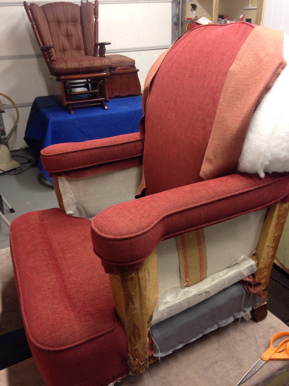 A chair in the process of being reupholstered. As you can see, we strip furniture down to it's frame when needed, replacing everything that needs replacing, including broken springs and foam or cushioning.